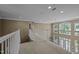 Open second floor hallway overlooking main level at 9432 Palm Bay Cir, Raleigh, NC 27617