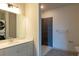 Bathroom with vanity, shower, and washer/dryer at 2326 Gathering Sq Ct, Fuquay Varina, NC 27526