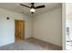 Bright bedroom with ceiling fan and walk-in closet at 2326 Gathering Sq Ct, Fuquay Varina, NC 27526
