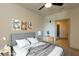 Virtually staged bedroom with gray bedding and modern decor at 2326 Gathering Sq Ct, Fuquay Varina, NC 27526