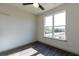 Bedroom with large window, hardwood floors and ceiling fan at 2326 Gathering Sq Ct, Fuquay Varina, NC 27526