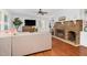 Living room with L-shaped sofa, fireplace, and hardwood floors at 1604 Burnt Mill Rd, Rocky Mount, NC 27804