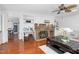 Living room features a brick fireplace, built-in shelving, and hardwood floors at 1604 Burnt Mill Rd, Rocky Mount, NC 27804