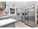 Modern kitchen with gray cabinets, stainless steel appliances, and white countertops at 1604 Burnt Mill Rd, Rocky Mount, NC 27804