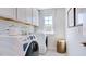 Convenient laundry room with washer, dryer, and ample storage at 2620 Stonington Dr, Cary, NC 27523