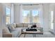 Bright Gathering room featuring a comfortable sectional sofa and large windows at 2620 Stonington Dr, Cary, NC 27523