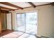 Bright living room with sliding glass doors leading to patio at 513 Clayton Ave, Roxboro, NC 27573