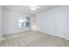 Bright bedroom with neutral carpet, ceiling fan and closet at 6702 Twin Tree Ct, Raleigh, NC 27613