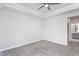 Spacious bedroom with ceiling fan and access to bathroom at 1230 Linkwood, Homesite 44, Fuquay Varina, NC 27526