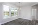 Bright dining room with chandelier and view of backyard at 1230 Linkwood, Homesite 44, Fuquay Varina, NC 27526