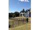 Gray house exterior with landscaping and black fence at 1230 Linkwood, Homesite 44, Fuquay Varina, NC 27526