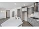 Modern kitchen with gray cabinets, quartz countertops, and stainless steel appliances at 1230 Linkwood, Homesite 44, Fuquay Varina, NC 27526