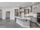 Modern kitchen with gray cabinets, quartz countertops, and stainless steel appliances at 1230 Linkwood, Homesite 44, Fuquay Varina, NC 27526