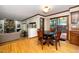 Charming dining area with dark wood table and chairs, adjacent to the kitchen and living room at 403 Rutherglen Dr, Cary, NC 27511