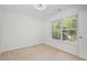 Well-lit bedroom featuring a large window at 517 Birchrun Dr, Durham, NC 27712