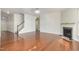 Living room with hardwood floors, fireplace and staircase at 517 Birchrun Dr, Durham, NC 27712