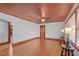 Bright living room with hardwood floors, wood ceiling, and a fireplace at 435 Tant Rd, Zebulon, NC 27597