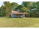 Rustic barn with covered porch and fenced yard at 435 Tant Rd, Zebulon, NC 27597