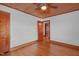 Hardwood floor bedroom with door to another room at 435 Tant Rd, Zebulon, NC 27597