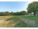 Open pasture with a small shed and pond at 435 Tant Rd, Zebulon, NC 27597