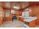 Kitchen boasts wood cabinets, stainless steel appliances, and wood flooring at 435 Tant Rd, Zebulon, NC 27597