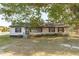 House front with lawn and landscaping at 435 Tant Rd, Zebulon, NC 27597