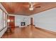 Living room featuring hardwood floors, fireplace, and wood ceiling at 435 Tant Rd, Zebulon, NC 27597