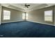 Bright and spacious main bedroom with plush carpeting and multiple windows at 457 Oak Alley Trl, Clayton, NC 27527