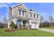 Two-story home with a neutral color scheme, two-car garage, and landscaping at 23 Eagle Crest Ct # Holly English Country, Lillington, NC 27546