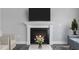 Modern fireplace with white mantel and a cozy fire at 23 Eagle Crest Ct # Holly English Country, Lillington, NC 27546