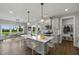 Modern kitchen with island, gray cabinets and breakfast area at 23 Eagle Crest Ct # Holly English Country, Lillington, NC 27546