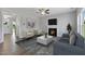 Bright living room features hardwood floors and a fireplace at 23 Eagle Crest Ct # Holly English Country, Lillington, NC 27546