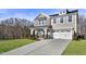 Two-story home with a neutral color scheme, two-car garage, and landscaping at 23 Eagle Crest Ct # Holly English Country, Lillington, NC 27546