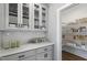 Well-organized pantry with glass-front cabinets and shelving at 23 Eagle Crest Ct # Holly English Country, Lillington, NC 27546