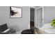 Modern home office with glass desk, laptop, and large art piece at 23 Eagle Crest Ct # Holly English Country, Lillington, NC 27546