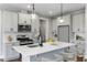 Modern kitchen with gray cabinets, quartz counters and island at 23 Eagle Crest Ct # Holly English Country, Lillington, NC 27546