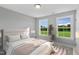 Bedroom with two windows and green view at 23 Eagle Crest Ct # Holly English Country, Lillington, NC 27546