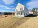 Two-story white house with front porch and grassy yard at 252 Steel Springs Lane Rd # 51, Angier, NC 27501