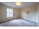 Charming bedroom with neutral carpeting and window shutters at 526 Weathergreen Dr, Raleigh, NC 27615