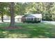 Ranch home with screened porch, attached garage, and fenced yard at 5906 Lillian Dr, Hurdle Mills, NC 27541