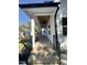 Inviting front porch with brick steps and ceiling fan at 2710 - A Mansfield Ave, Durham, NC 27703
