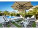 Inviting pool area with patio furniture and fire pit at 117 Hardy Oaks Way, Holly Springs, NC 27540