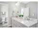 Elegant bathroom with double vanity, granite countertops, and a separate shower at 117 Hardy Oaks Way, Holly Springs, NC 27540