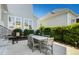 Grey patio table with chairs in a fenced backyard at 117 Hardy Oaks Way, Holly Springs, NC 27540