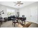 Bright home office features built-in shelving and comfortable seating at 117 Hardy Oaks Way, Holly Springs, NC 27540