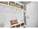 Charming mudroom with built-in bench, cubbies, and hooks at 117 Hardy Oaks Way, Holly Springs, NC 27540