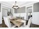 Formal dining room features a wood table and bench seating at 117 Hardy Oaks Way, Holly Springs, NC 27540