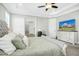 Main bedroom with large TV and plenty of space at 117 Hardy Oaks Way, Holly Springs, NC 27540