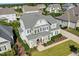 Two-story house with grey siding, stone accents and manicured lawn at 117 Hardy Oaks Way, Holly Springs, NC 27540
