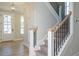 Bright entryway with hardwood floors and staircase at 6045 Scalybark Road, Durham, NC 27712